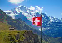 Swiss flag and Swiss Alps