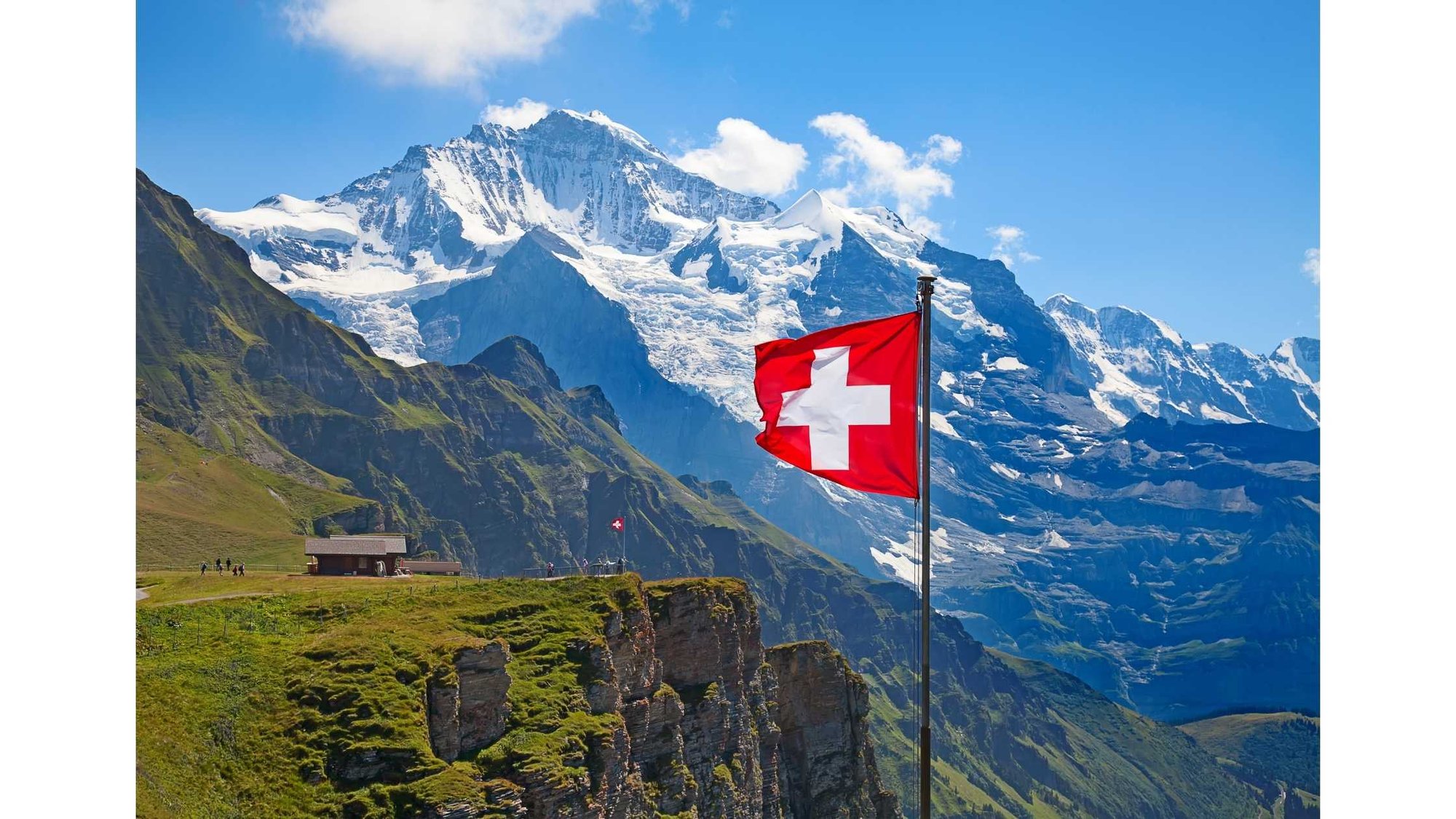 Swiss flag and Swiss Alps