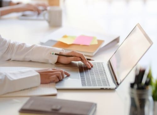 businessman-working-laptop-pencil