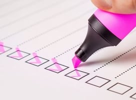 Checking off list with pink highlighter