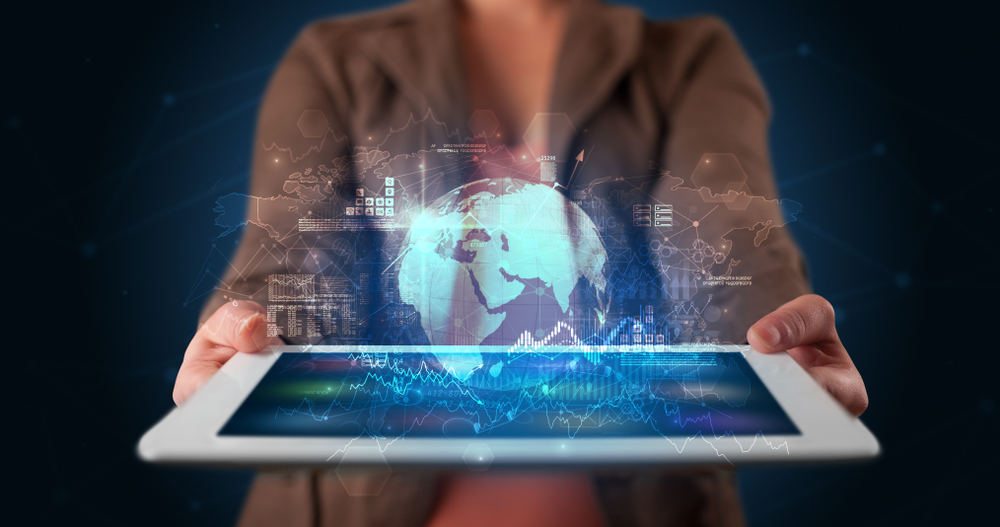 Hand holding tablet with global database concept Hand holding tablet with global database concept
