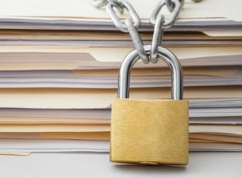 Stack of documents with a padlock Stack of documents with a padlock